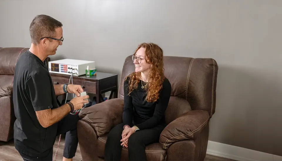 Dr. Bryan Ruocco talking through a treatment plan with a patient at Power of Life Health Center