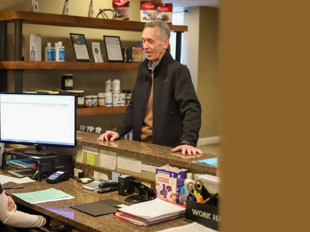 A patient checking in at the front desk of Power of Life Health Center in Rocky River